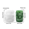 A silicone mold for making candles featuring a dragon design with a cloud pattern in a green color.