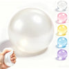 A white, spherical coconut oil squishy stress ball is shown next to several colored variations.