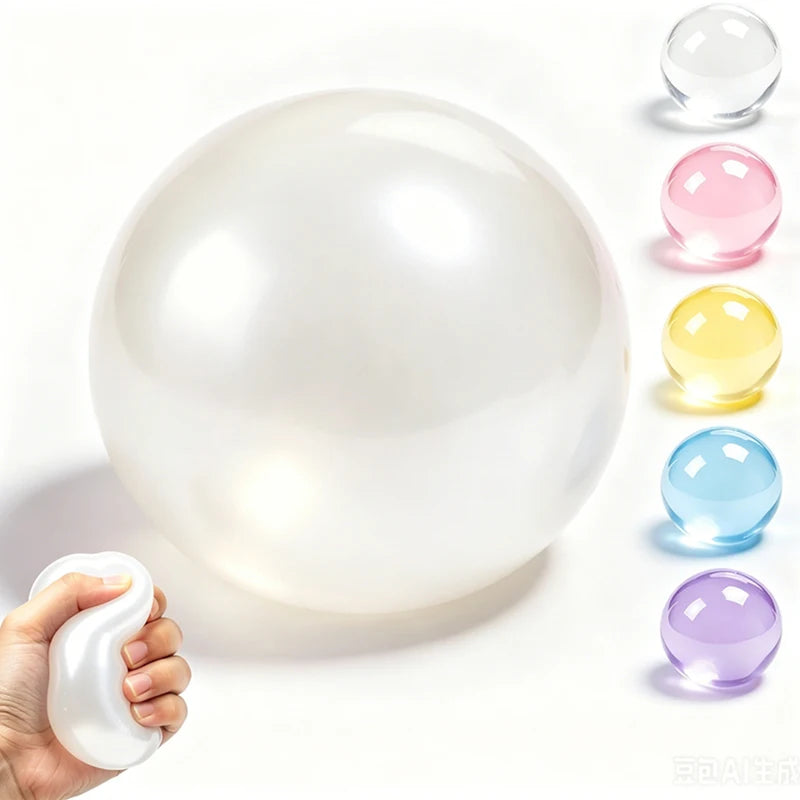 A white, spherical coconut oil squishy stress ball is shown next to several colored variations.