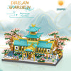 A detailed micro building block set of a marriage pavilion and garden featuring traditional Chinese architecture and pink flo