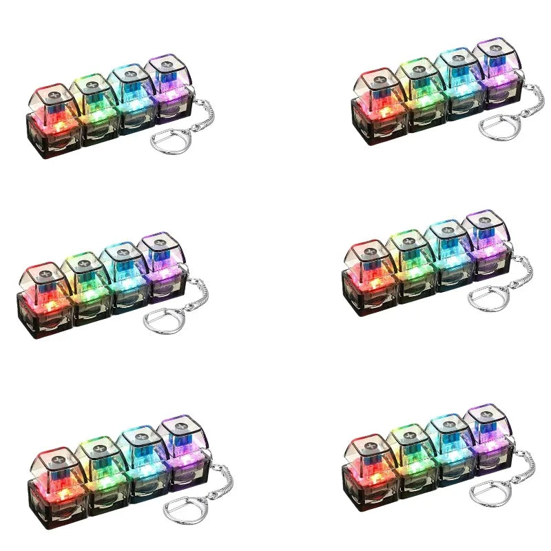 A set of illuminated stress-relief keychain toys featuring colorful keyboard buttons.
