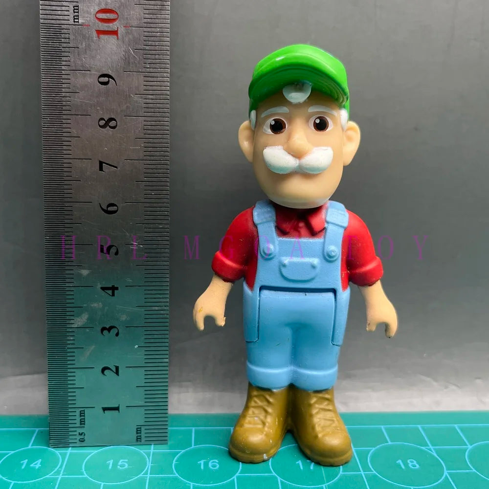 A playful cartoon PVC figurine of a man with a white mustache wearing a red shirt and blue overalls.