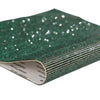 Green sparkling rhinestone adhesive tape rolled up for DIY crafts and decor