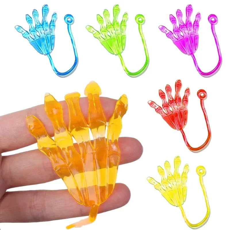 A set of colorful, stretchy, sticky climbing toys shaped like hands and fingers for Halloween party favors.