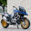 A blue and black BMW motorcycle diecast model with lights and suspension on a gray surface.