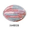 A ball of pink and blue chunky chenille yarn for hand knitting projects.