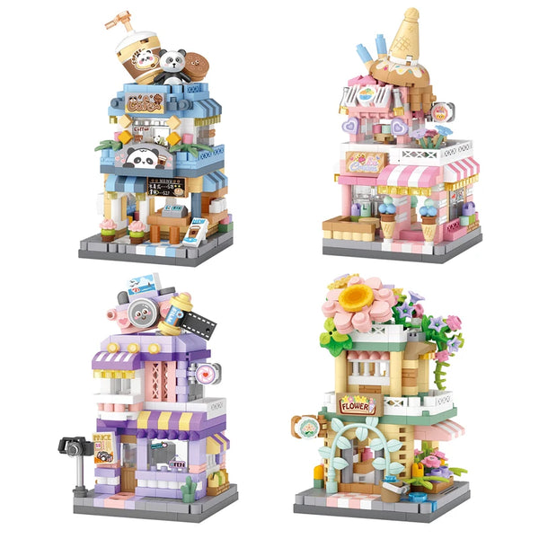 A detailed cityscape building block set featuring various buildings and figures in pink, blue, and brown.