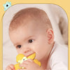 A baby is playing with a yellow suction cup spinner bath toy.