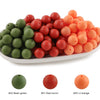 A bowl filled with round silicone beads in green, red brown, and light orange colors.