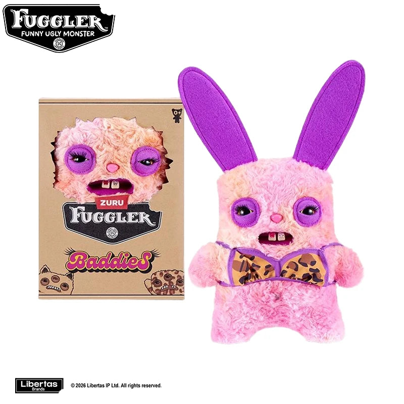 A pink Fuggler Tooth Monsters plush toy with purple ears and a patterned bow