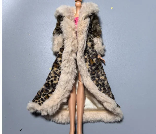 A fashion doll wearing a long coat with a brown leopard print and light fur trim.