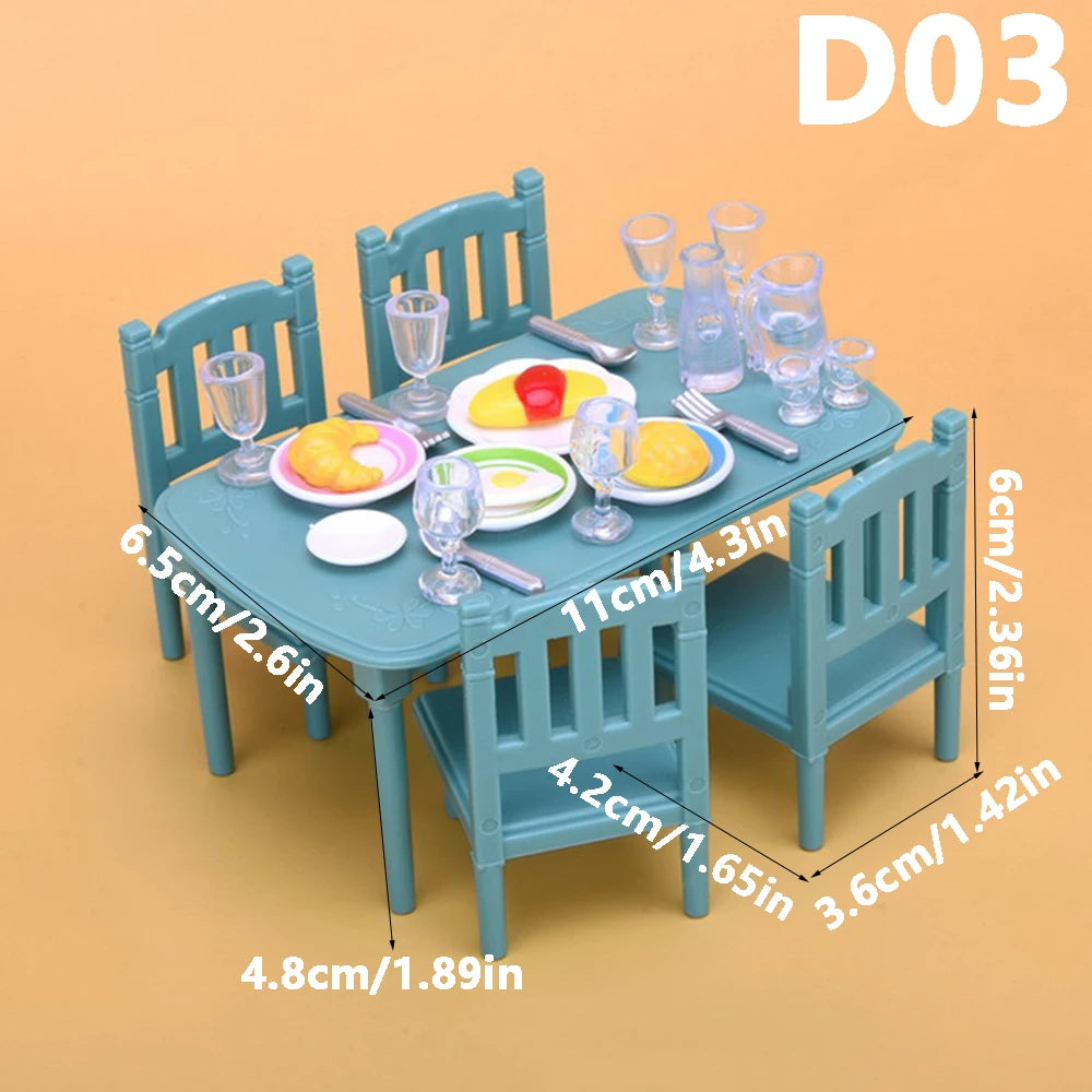 A teal wooden dollhouse furniture set featuring a dining table and chairs with various accessories.