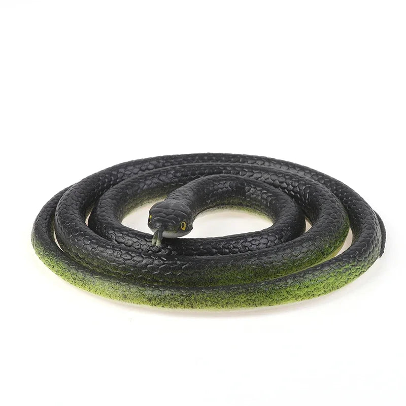 A realistic black snake prank toy coiled on a white background.