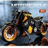 A black and orange vintage die-cast motorcycle model is shown in a studio setting.