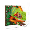 A building block set depicting a green shark head with orange accents and pink flowers, displayed on a brown background.