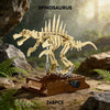 A detailed model of a Spinosaurus dinosaur built from light tan plastic blocks displayed on a brown base.