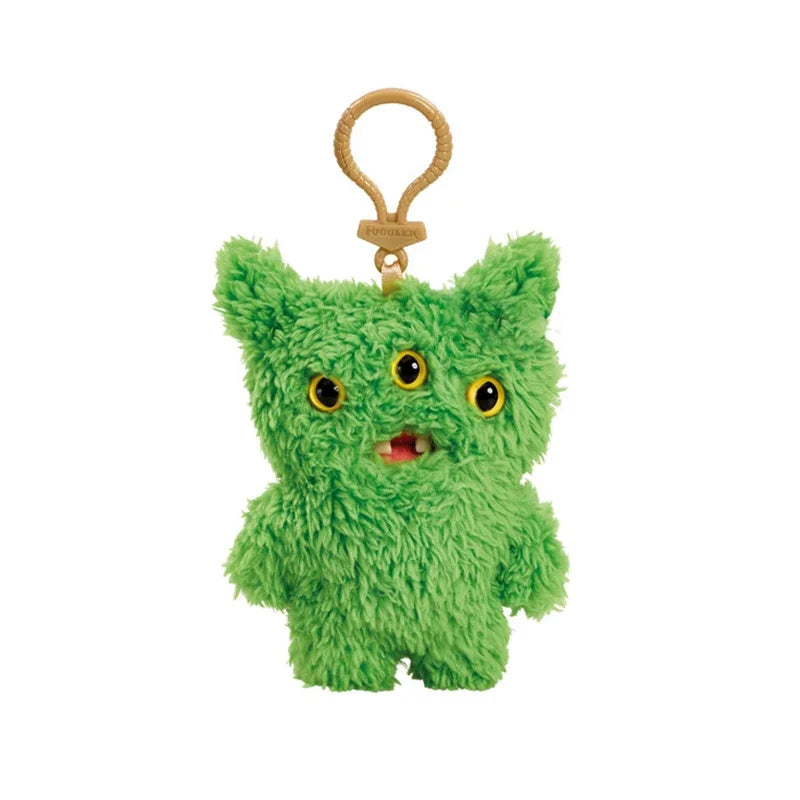 A bright green, fuzzy plush monster with yellow eyes and a small mouth attached to a gold-colored keychain ring.