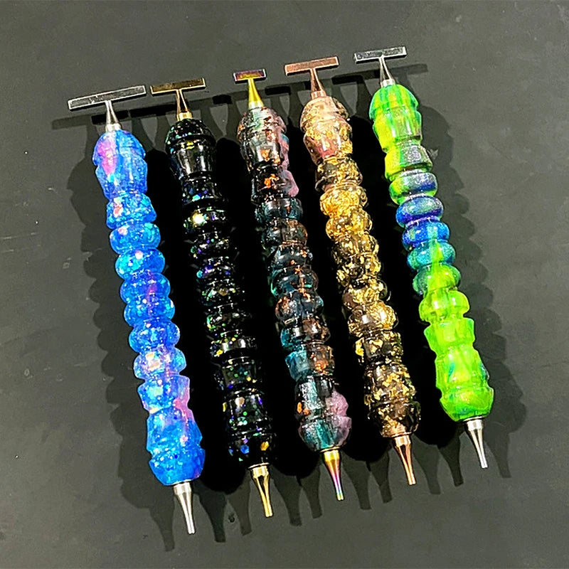 Five colorful diamond painting pens with stainless steel tips arranged in a row.