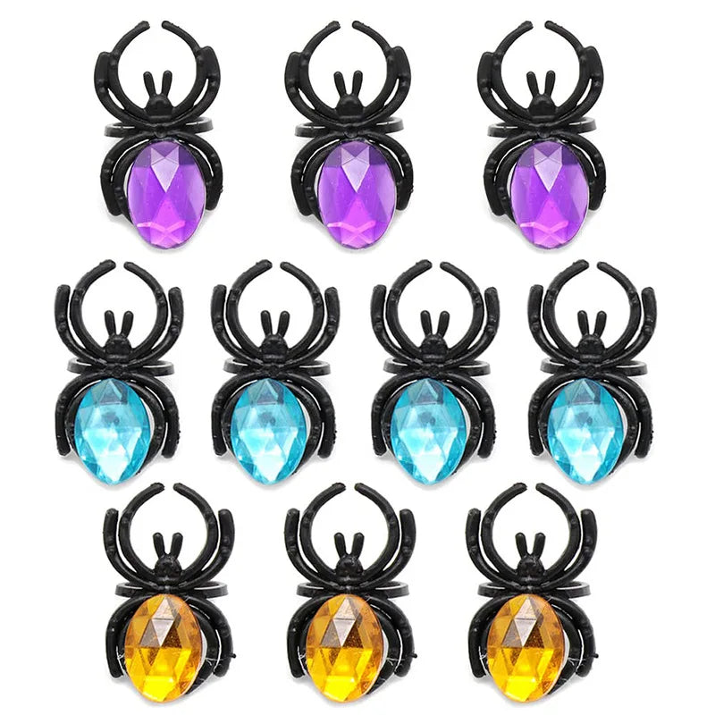 A set of ten Halloween skull and pumpkin fidget toys featuring various gemstone colors like purple, blue, and yellow.