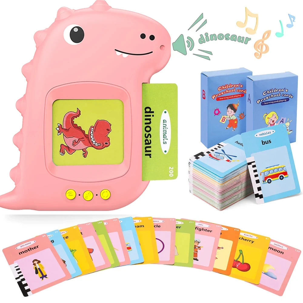 A pink dinosaur-shaped interactive flash card learning machine with various colorful cards and a bus toy.