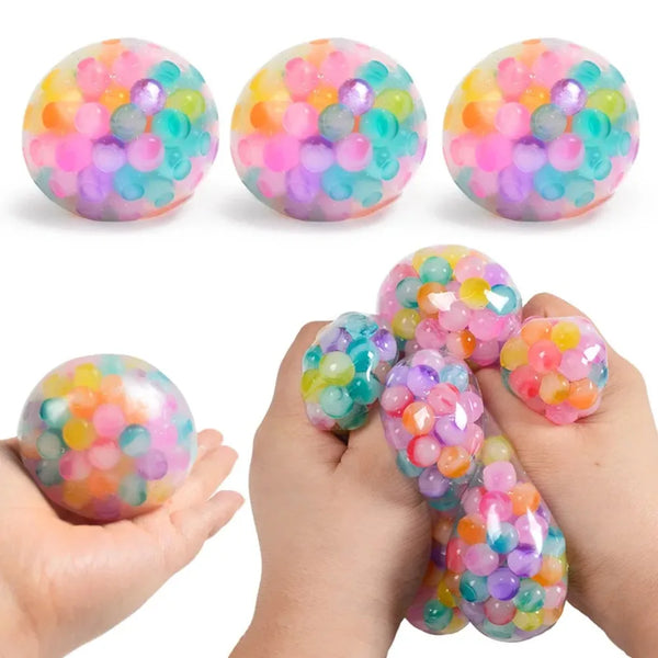 Three colorful pressure reducing fidget squishy toys are shown, with a hand holding several of them.