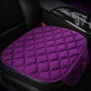 Purple quilted anti-slip car seat cushion set placed on a black car seat.