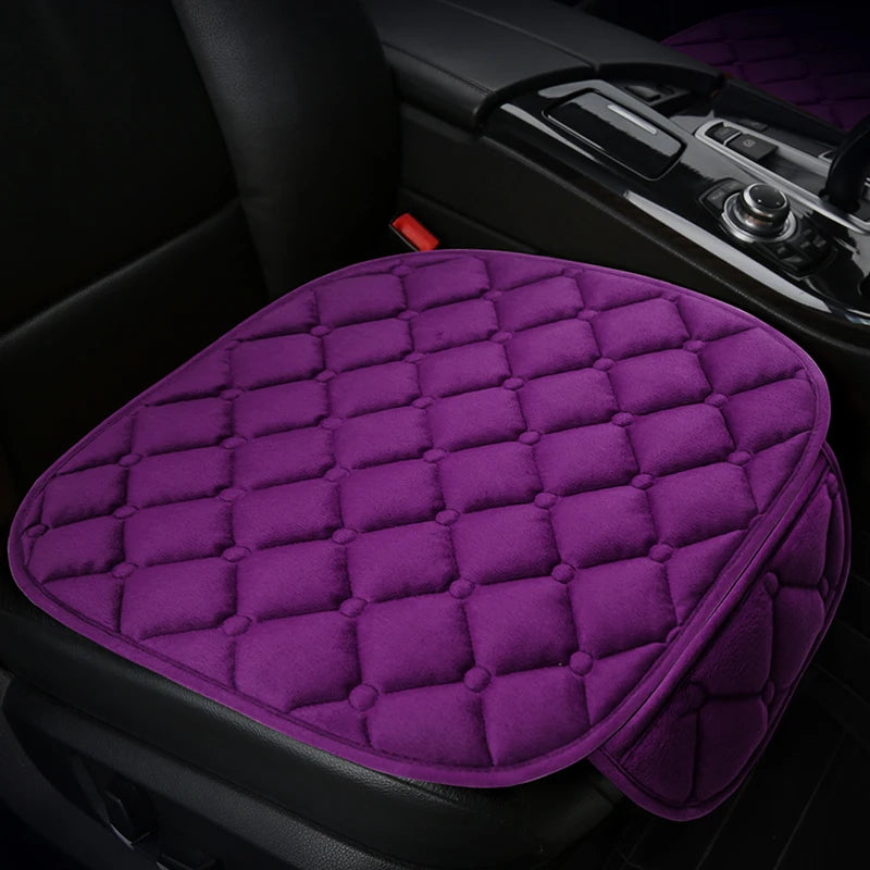 Purple quilted anti-slip car seat cushion set placed on a black car seat.