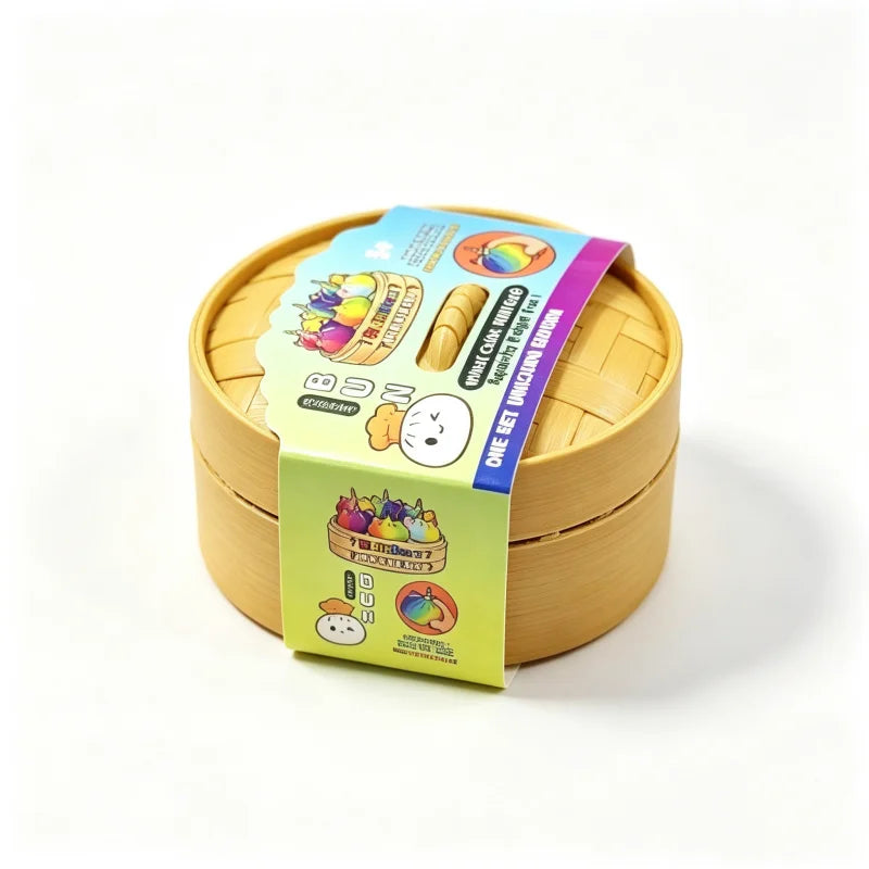 A yellow foam box containing a glitter unicorn dumpling squishy fidget toy with a steamer insert.