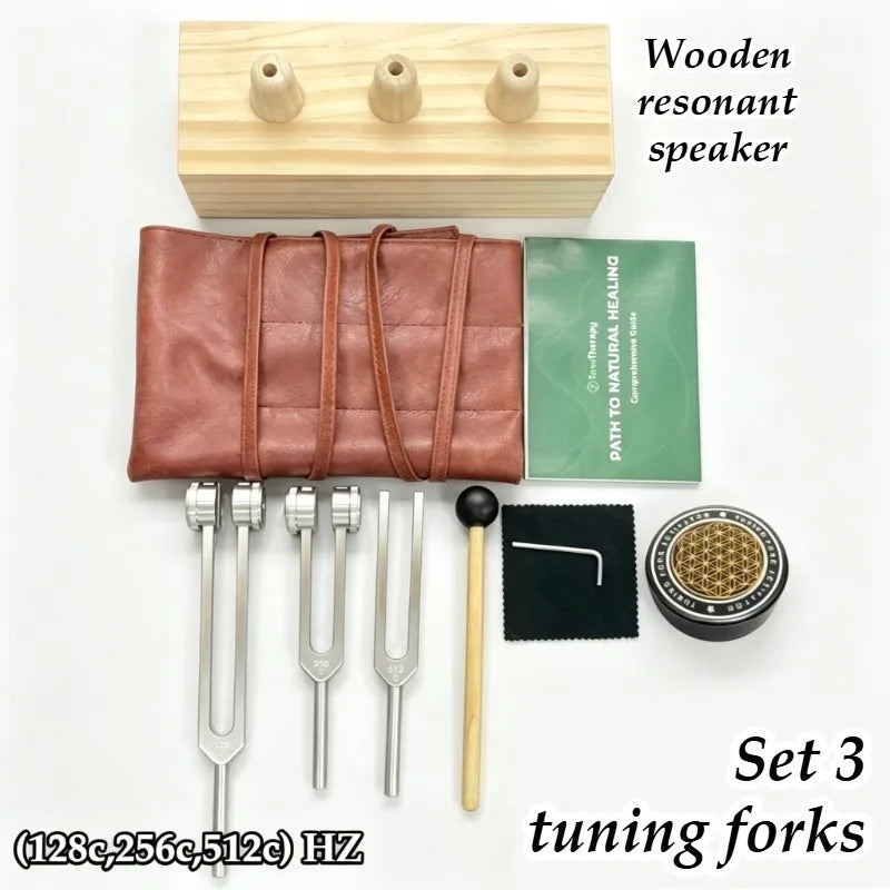 A set of three wooden tuning forks for sound healing and meditation, displayed next to a wooden box.