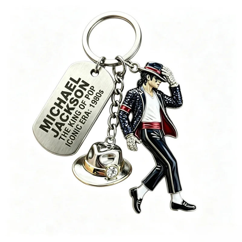 A silver keychain featuring a figure of Michael Jackson in a suit and hat.