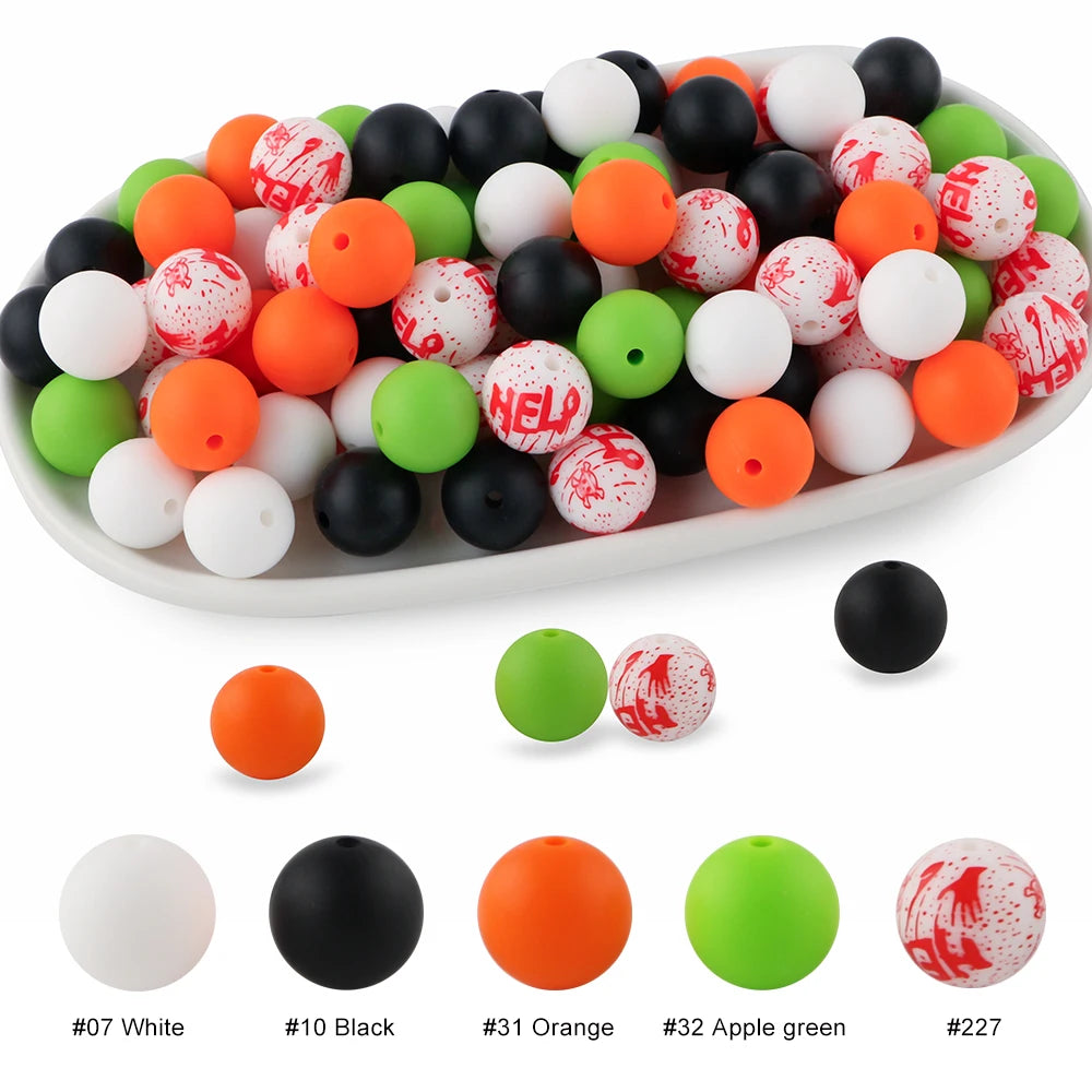 A platter filled with various colored silicone beads including white, black, orange, green, and red for crafts and jewelry.