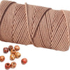 A skein of natural beige cotton macrame rope with decorative wooden beads scattered below.