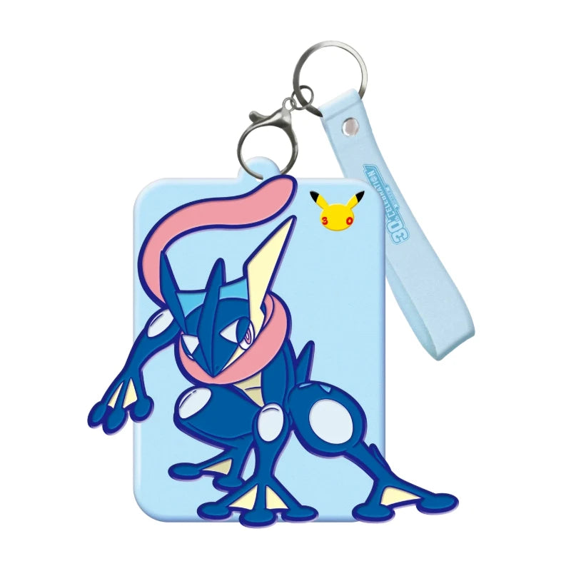 A display card set featuring Greninja and Sylveon Pokémon figures attached to a metal keyring.