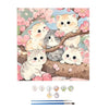 Paint by numbers kit featuring a cute kitten illustration in soft pastel colors on a wooden background.