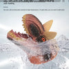 A realistic soft toy of a T-Rex dinosaur hand puppet is being washed under running water.
