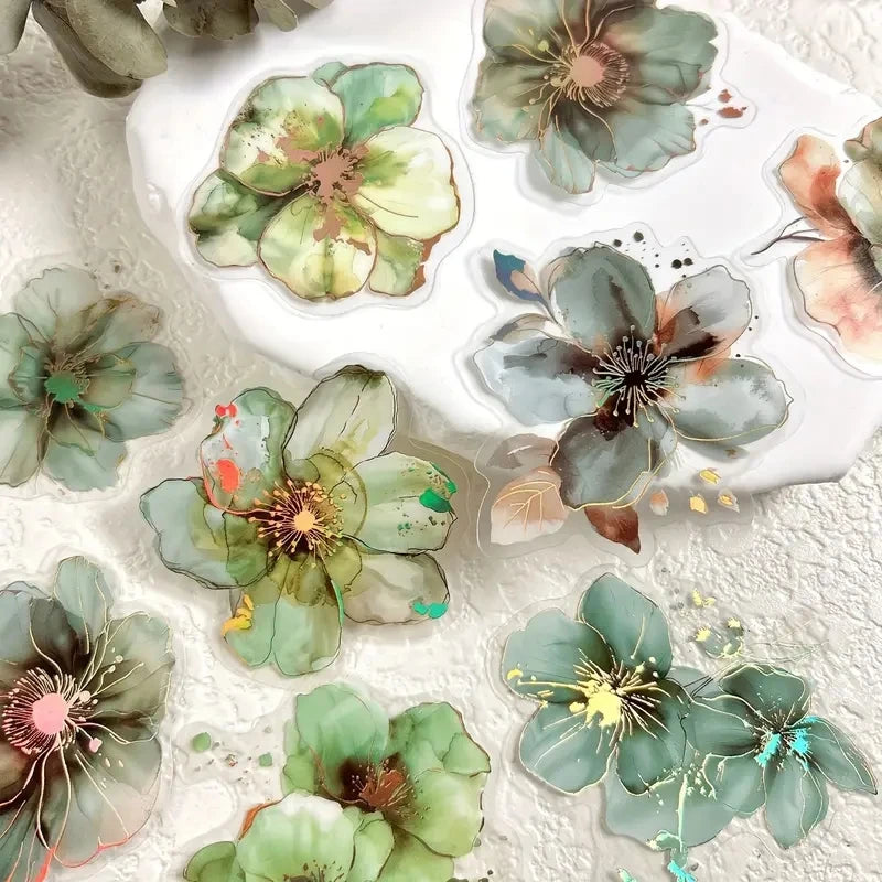 A collection of floral hot stamp stickers in various shades of green and brown on a white background.