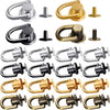 A collection of vintage metal D-ring buckle clips and hardware in various finishes and sizes.