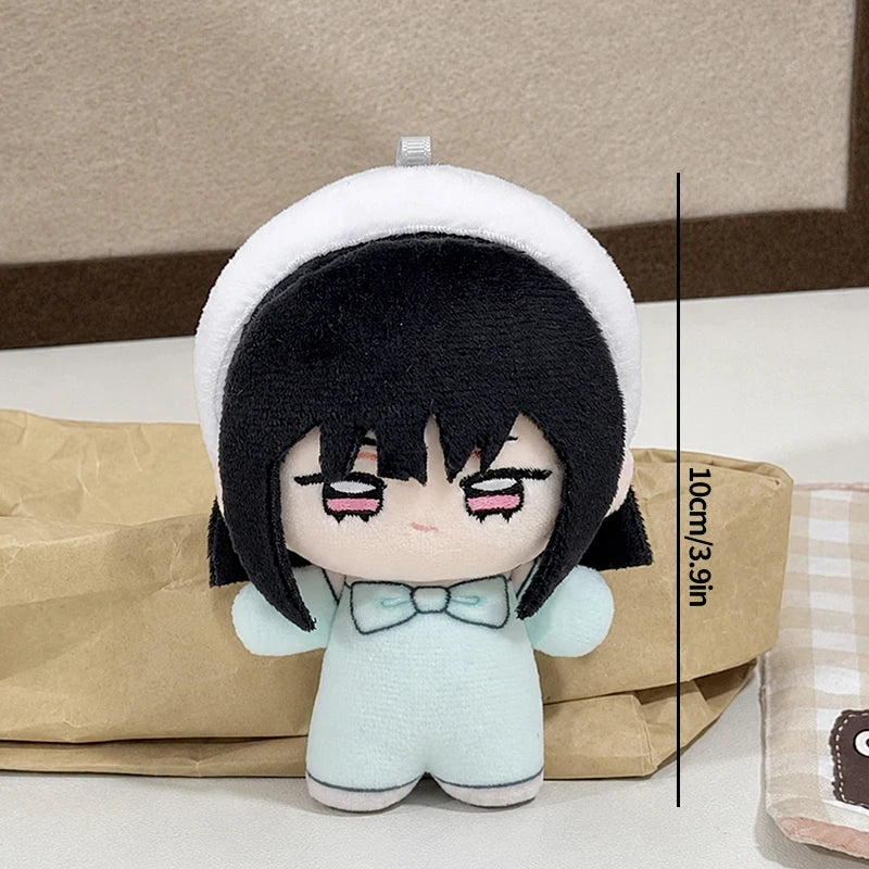 A chibi plush keychain of Alien Stage Ivan and Till featuring black hair, a white hat, and light blue clothing.