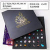 A black gift box containing a collection of natural crystal and mineral specimens displayed in a compartment.