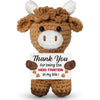 A handmade crochet cow doll with brown fur and white horns, expressing gratitude for being the moo-tivation in life.