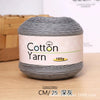 A skein of gray 100% cotton yarn labeled for knitting and crochet projects.