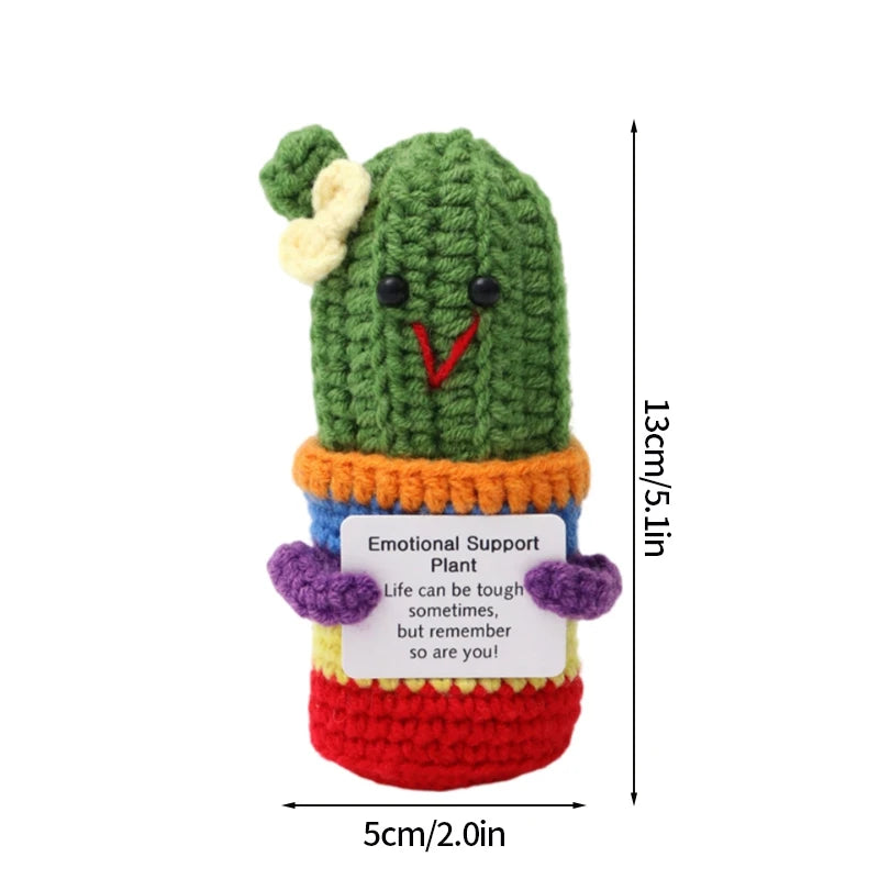 Handmade crochet pocket hug doll with a green body and orange belly featuring an inspirational support message