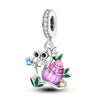 A silver heart charm bead featuring a pink zircon gemstone and a small green leaf detail.