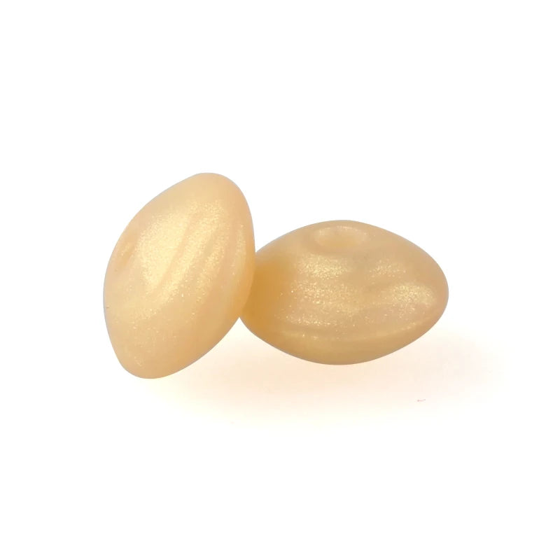 A pair of light yellow silicone lentil beads shaped like an abacus, used for jewelry making.