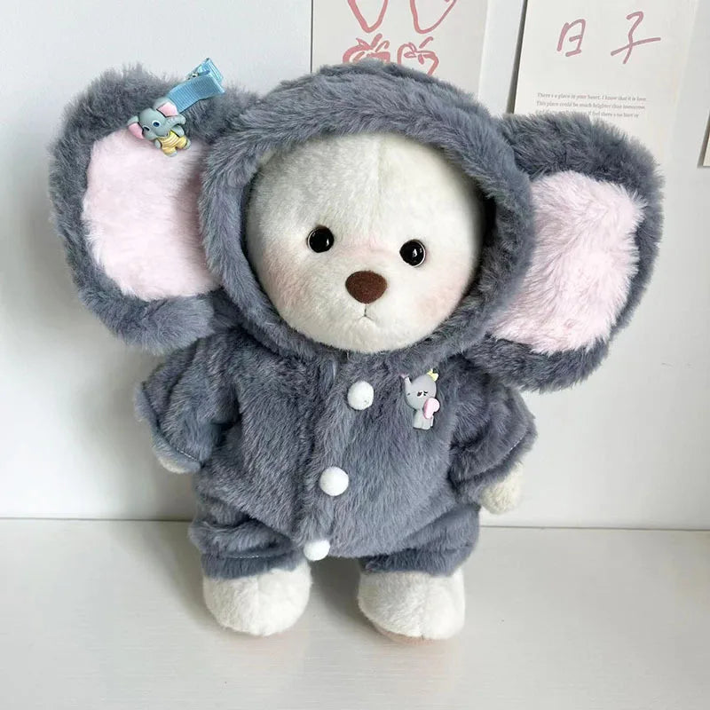 A gray plush doll with pink inner ears and a hood, wearing a matching outfit.