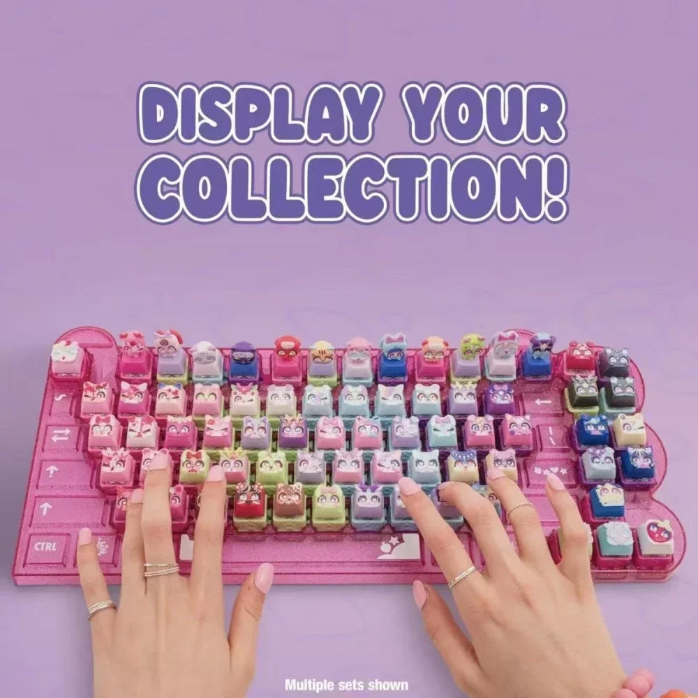 Hands display multiple sets of LED mechanical switch fidget keychains on a pink tray.
