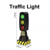 A black traffic light with green, yellow, and red lights mounted on a wooden track accessory.
