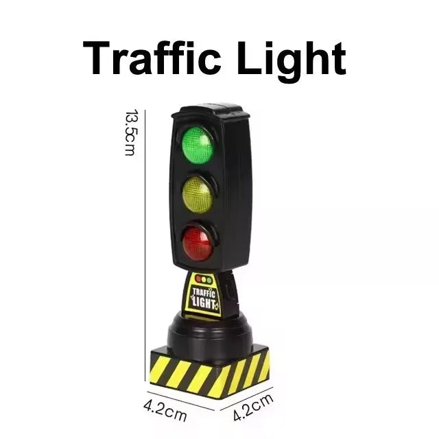 A black traffic light with green, yellow, and red lights mounted on a wooden track accessory.