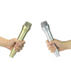 A hand holds a realistic toy microphone prop for kids' performances.