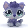 A small purple and gray pet figurine resembling a kitten or dog, with large eyes and pink accents.